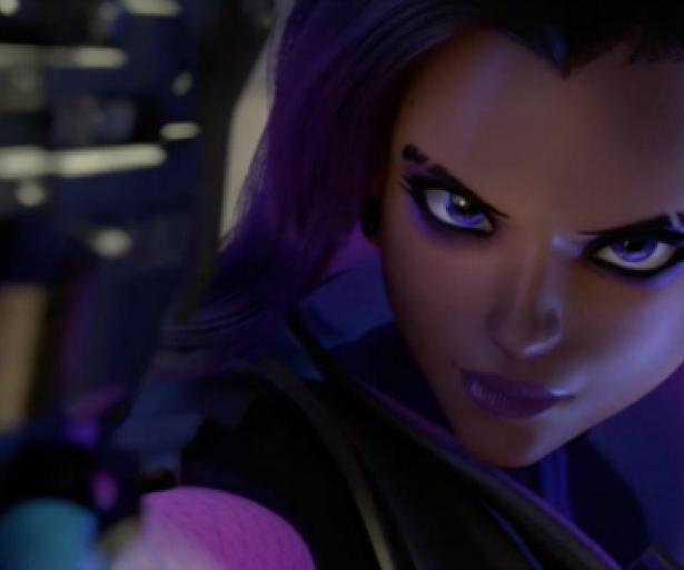 Sombra pointing her gun at the screen