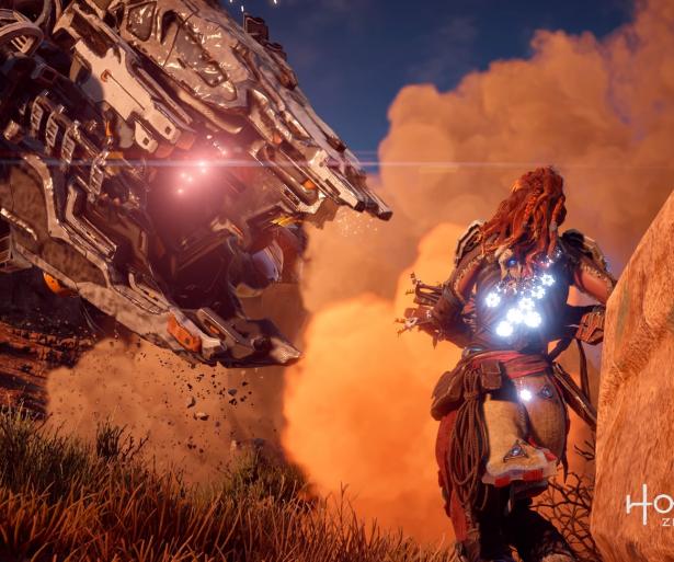 Shield Weaver Armor protecting Aloy from the attack of a Thunderjaw